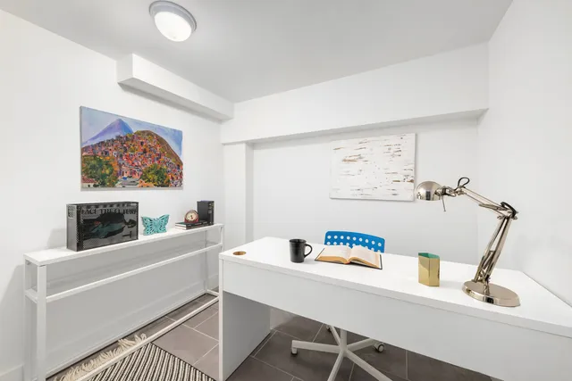 a view of a room that has a large window