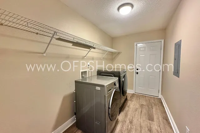 a view of a storage & utility room with washer and dryer