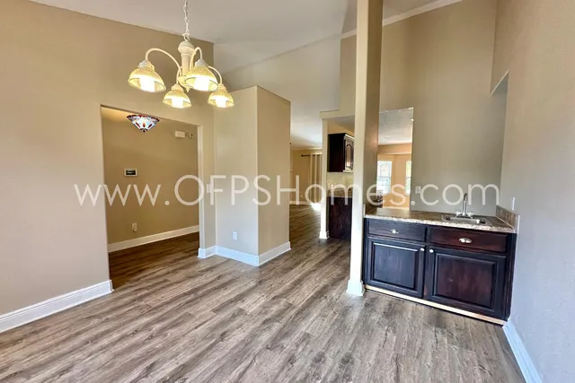 a view of a kitchen cabinets and wooden floor
