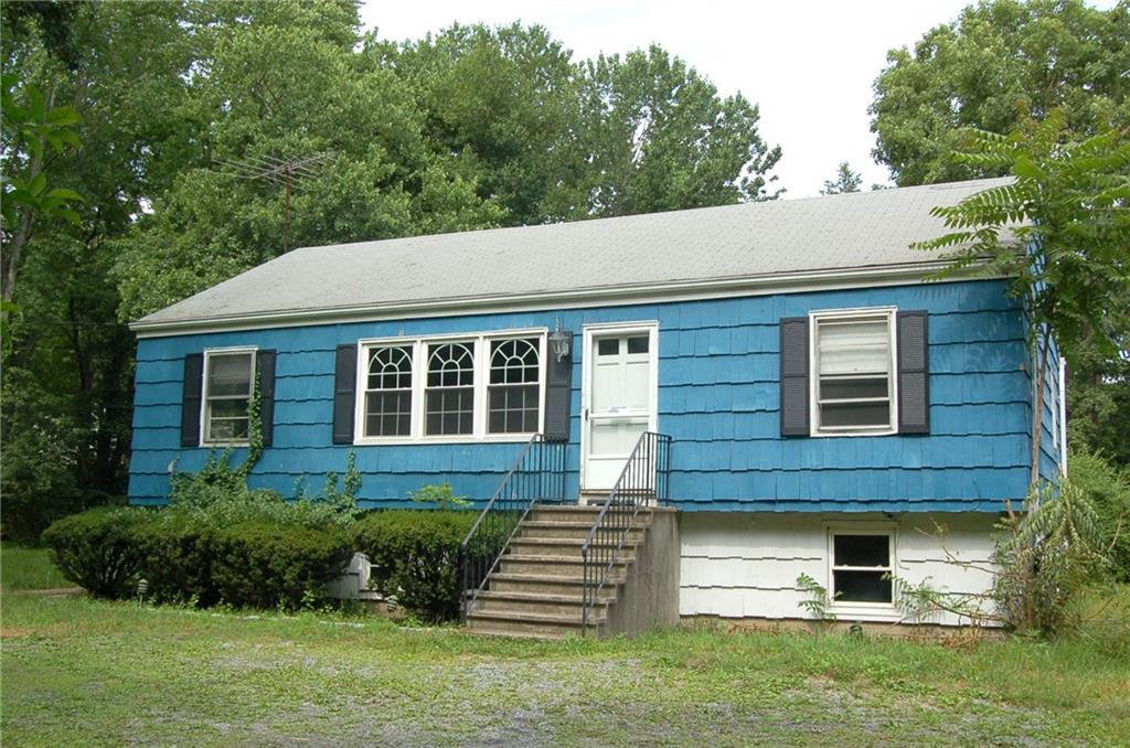 2005 High Ridge Road Stamford, CT 06903 - Photo 1 of 1 a front view of a house with a yard