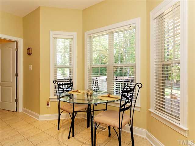 149 Alfred Court Raleigh, NC 27603 - Photo 9 of 24 a view of a dining room with furniture and windows