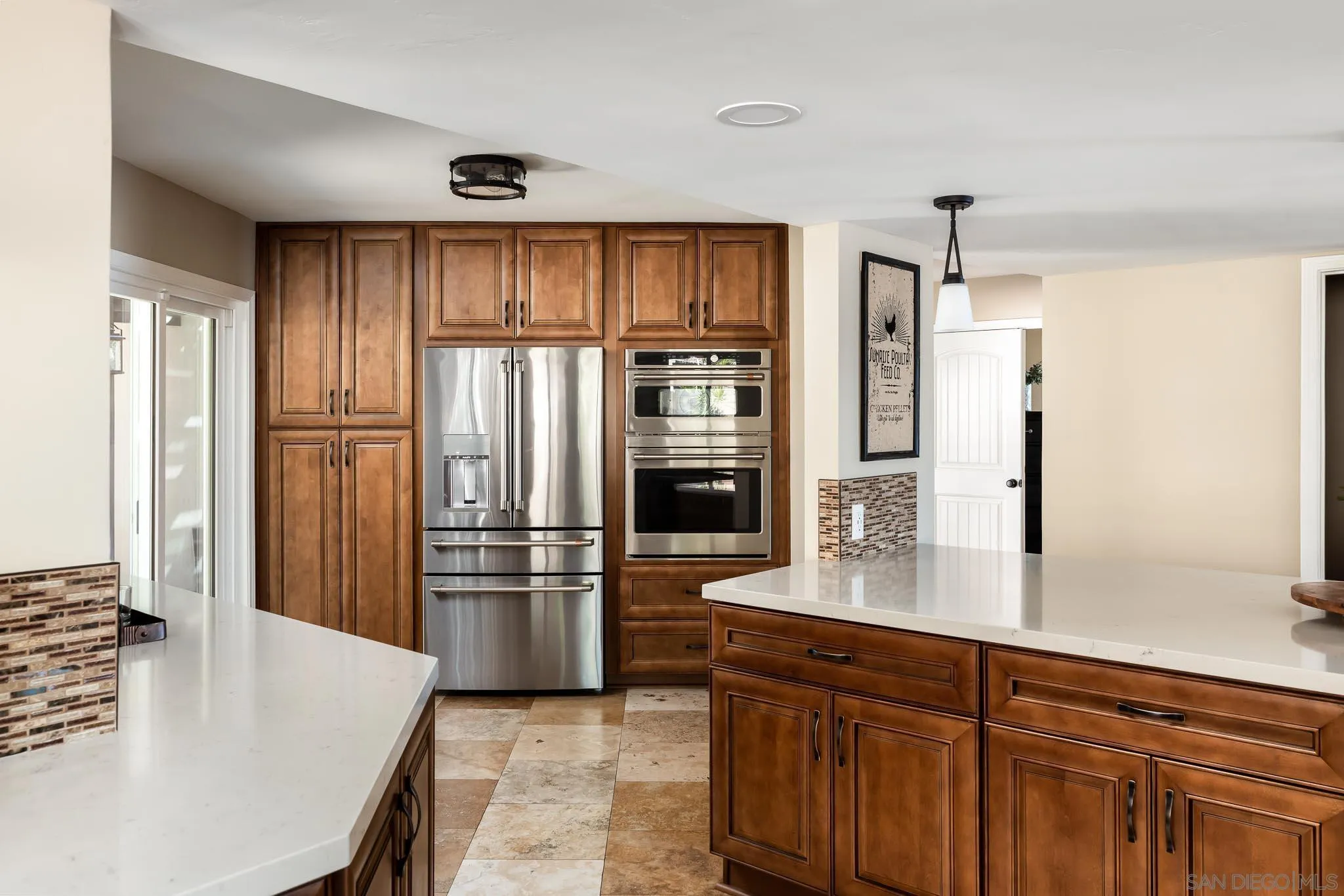 13647 Orchard Gate Road Poway, CA 92064 - Photo 11 of 43 a kitchen with kitchen island a counter top space stainless steel appliances and cabinets