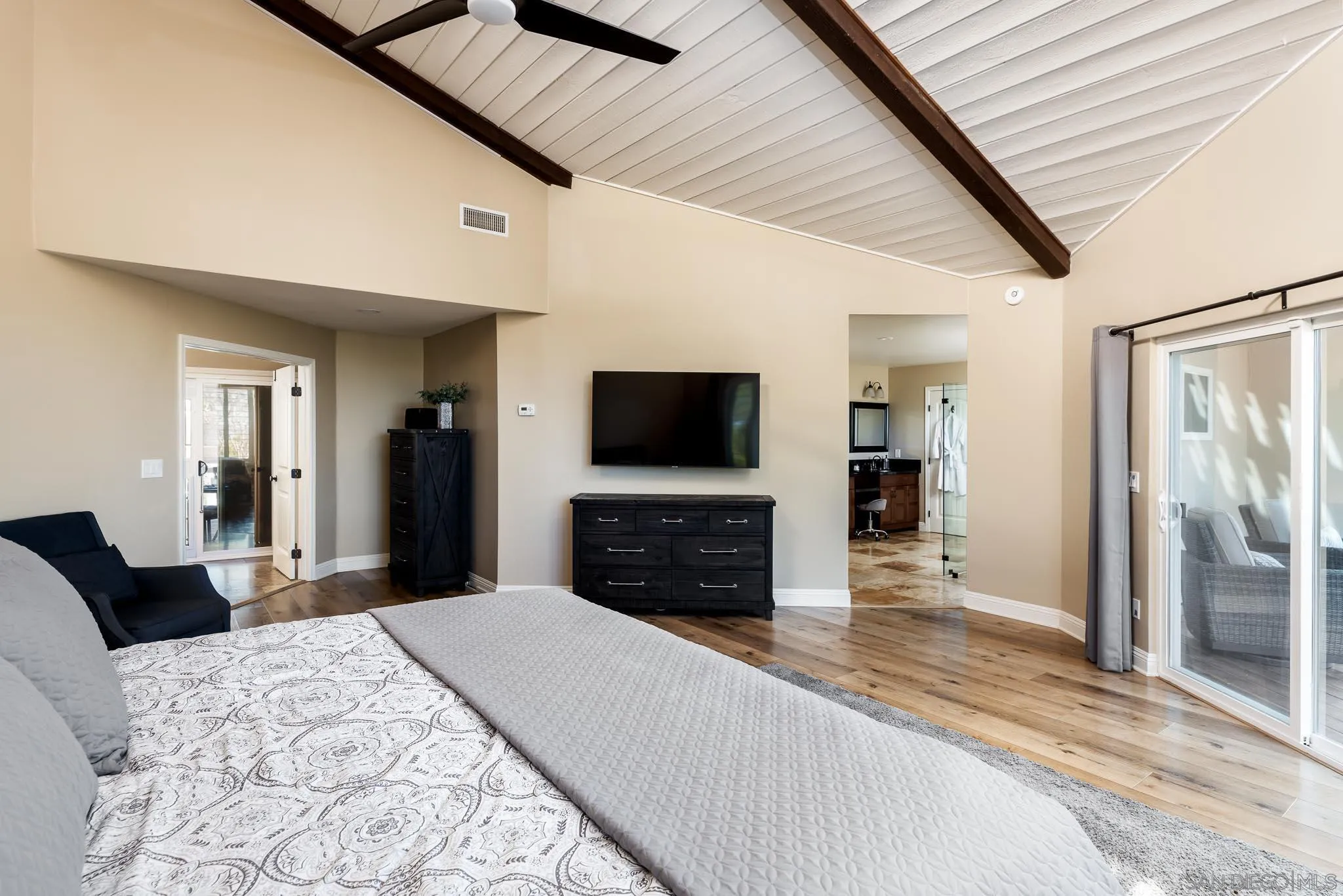 13647 Orchard Gate Road Poway, CA 92064 - Photo 15 of 43 a large bedroom with a bed and a flat screen tv