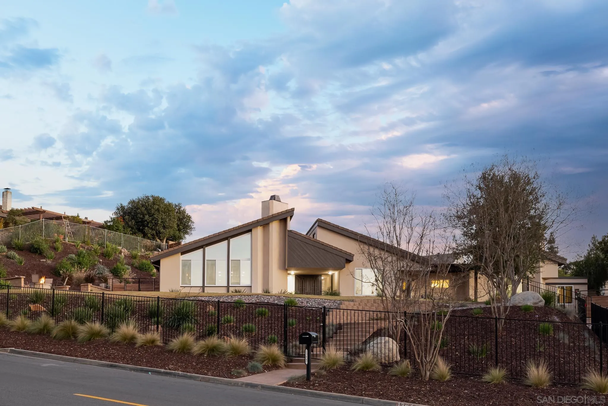 13647 Orchard Gate Road Poway, CA 92064 - Photo 2 of 43 a front view of a house with a yard