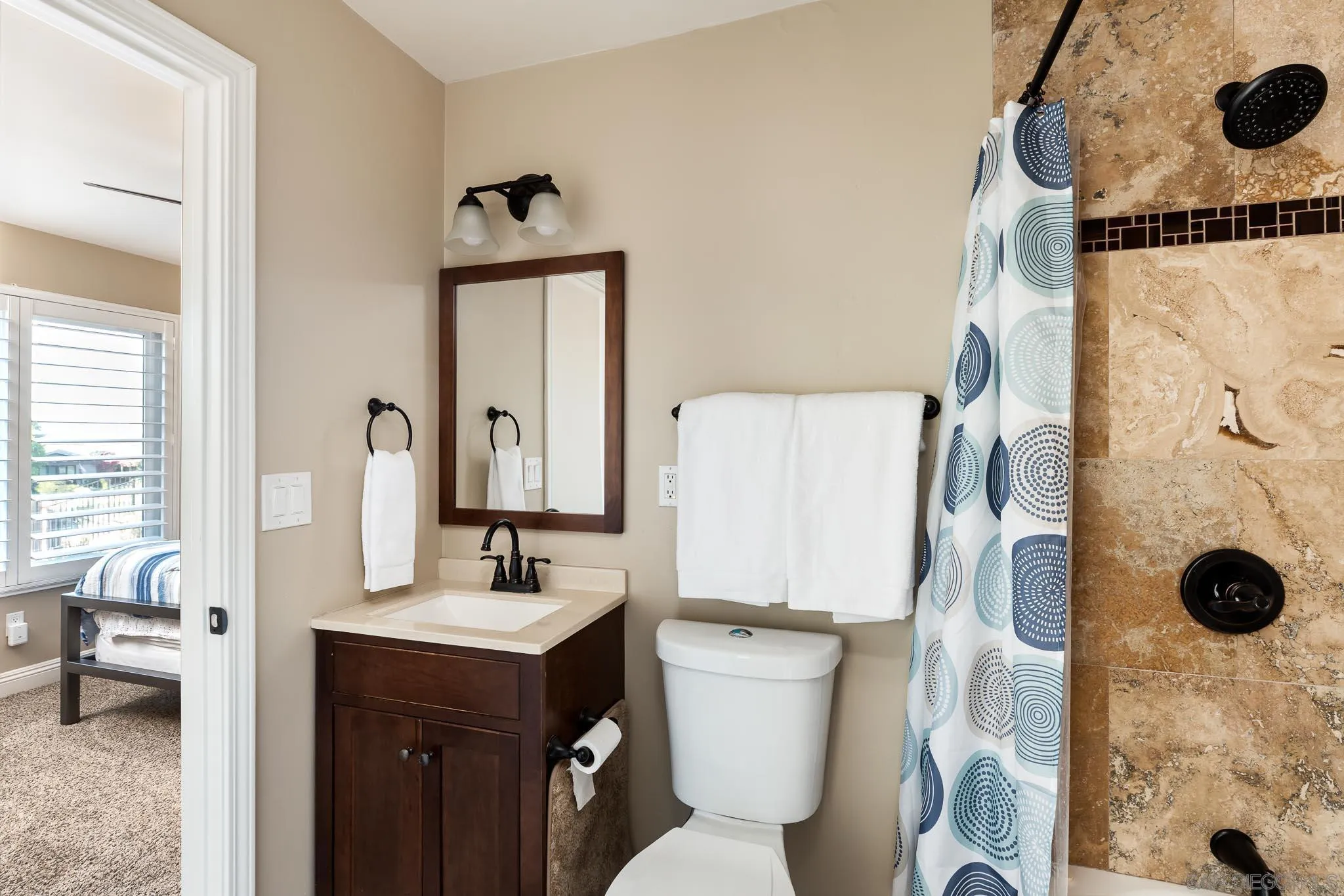 13647 Orchard Gate Road Poway, CA 92064 - Photo 22 of 43 a bathroom with a sink toilet and shower