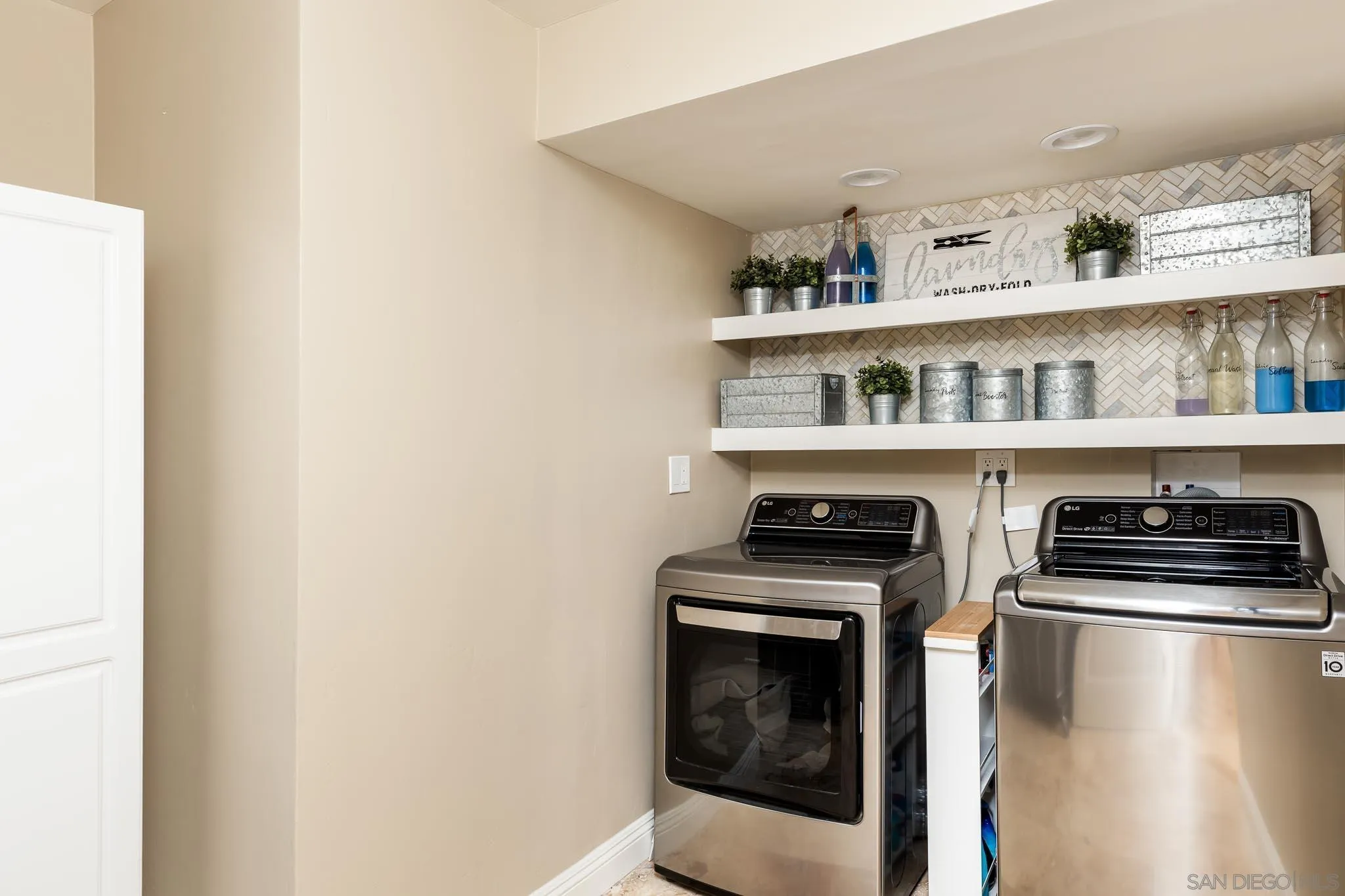 13647 Orchard Gate Road Poway, CA 92064 - Photo 25 of 43 a kitchen with stainless steel appliances granite countertop a stove a microwave and cabinets