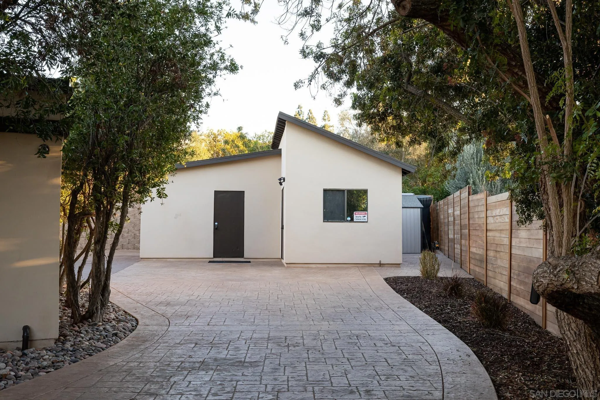 13647 Orchard Gate Road Poway, CA 92064 - Photo 33 of 43 a view of a house with a tree in the background