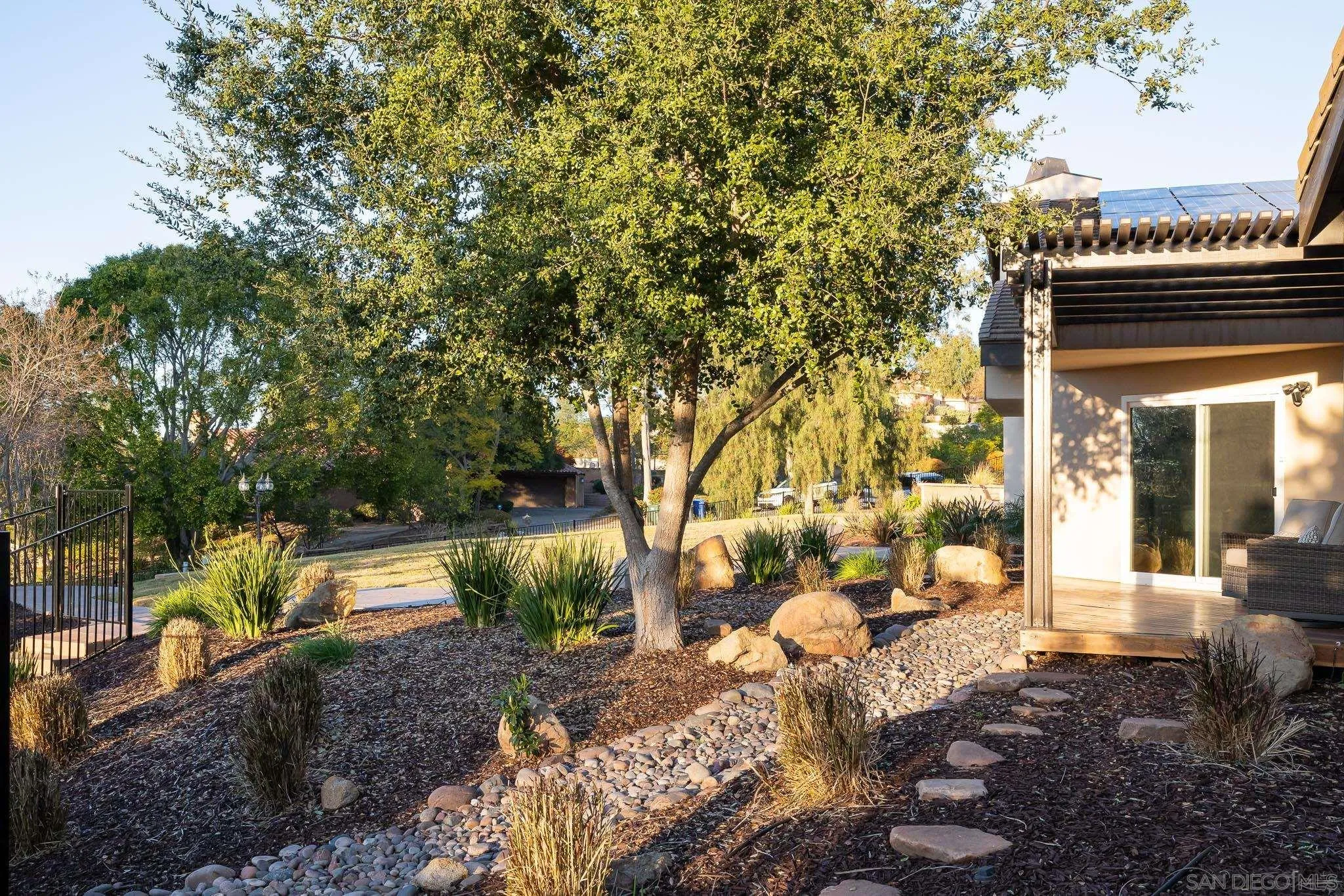 13647 Orchard Gate Road Poway, CA 92064 - Photo 36 of 43 a view of a house with a yard