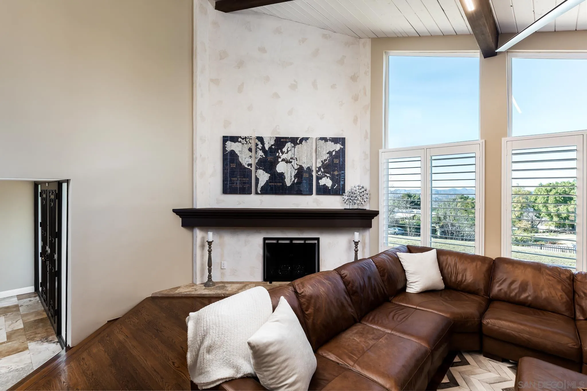 13647 Orchard Gate Road Poway, CA 92064 - Photo 6 of 43 a living room with furniture a fireplace and a large window