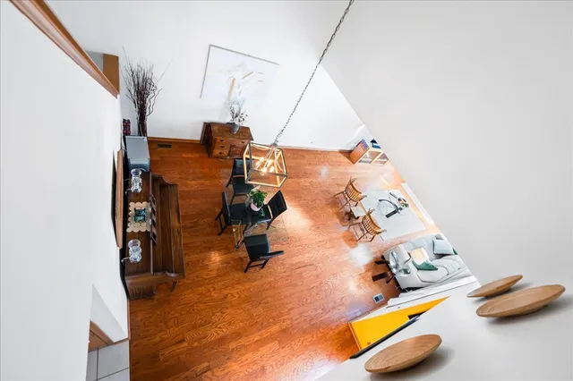 wooden floor with a table and a couch