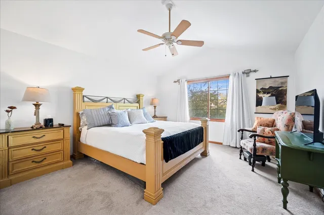 a bed room with a bed and a window