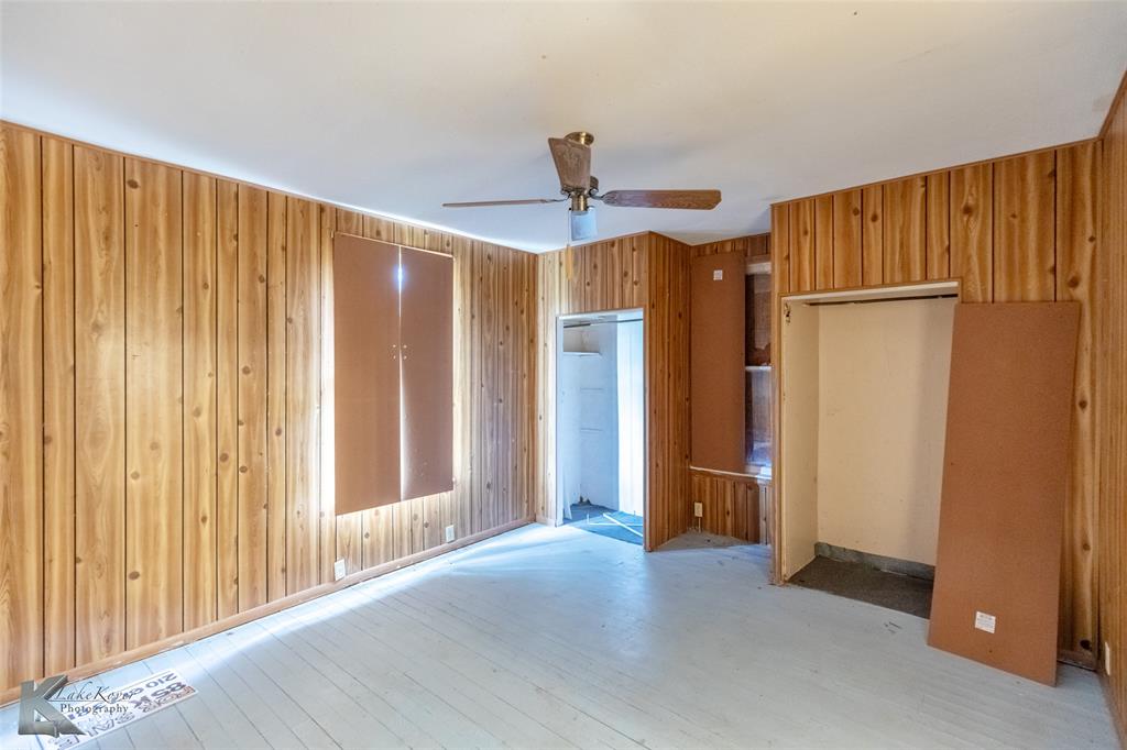 711 South Neches Street Coleman, TX 76834 - Photo 17 of 26 a view of a room with a walk in closet