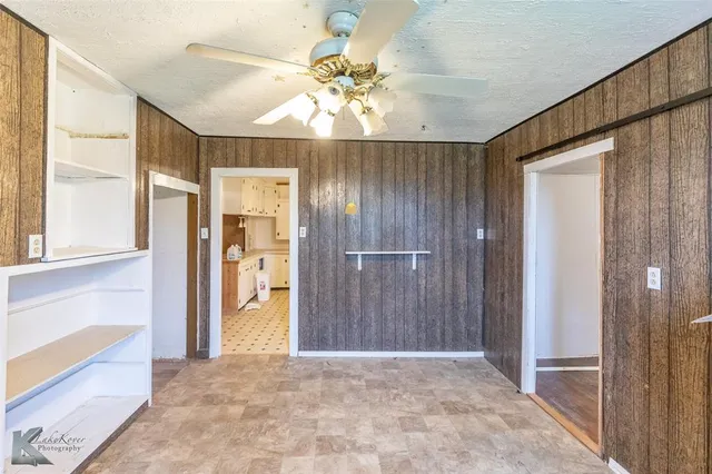 a view of entryway with a chandelier fan and livingroom view