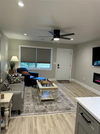 a kitchen with a table chairs refrigerator and microwave