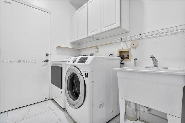 a view of a house with swimming pool and sitting area