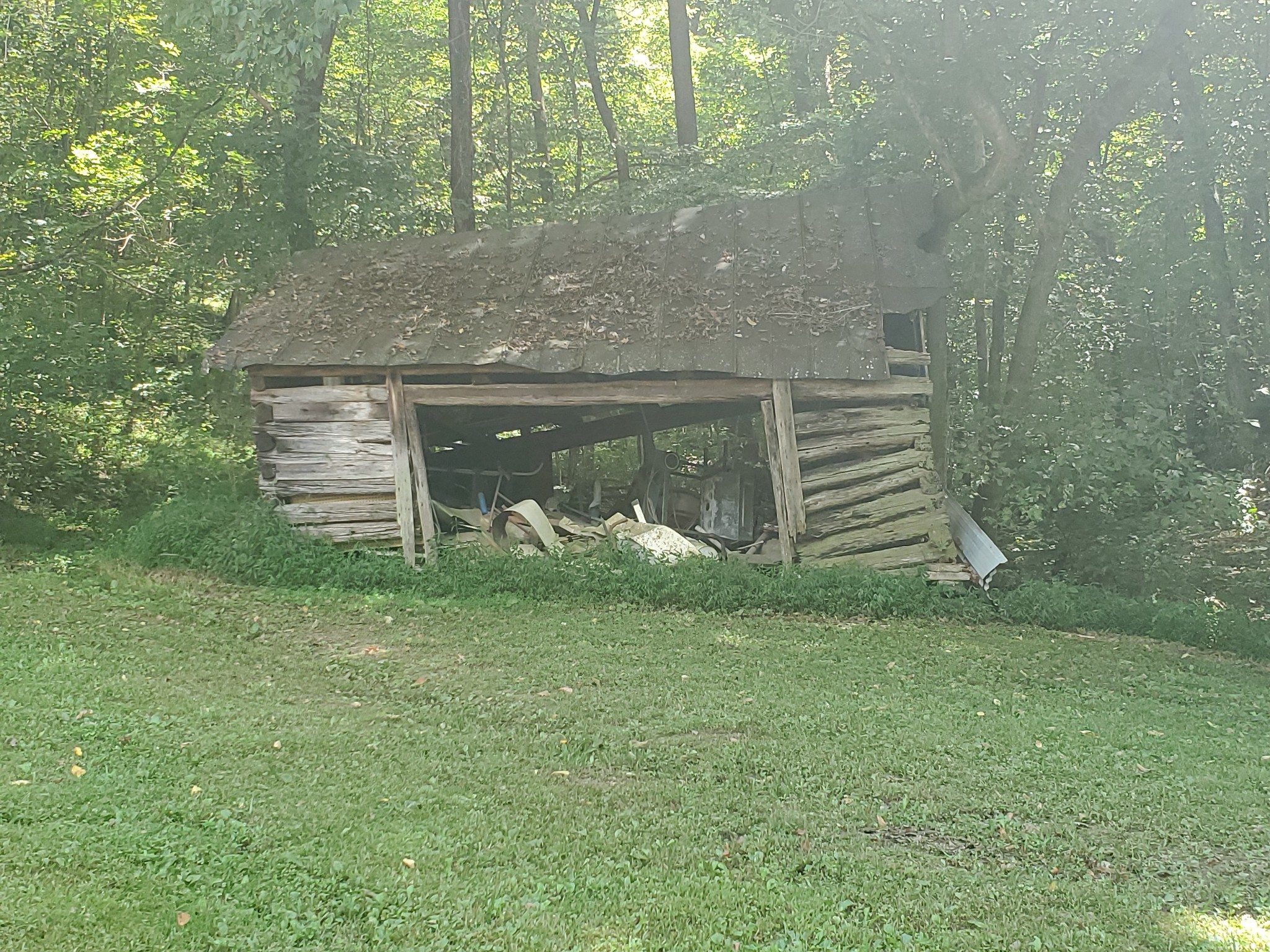 3979 Lem Davis Road Cunningham, TN 37052 - Photo 18 of 39 a front view of a house with a garden