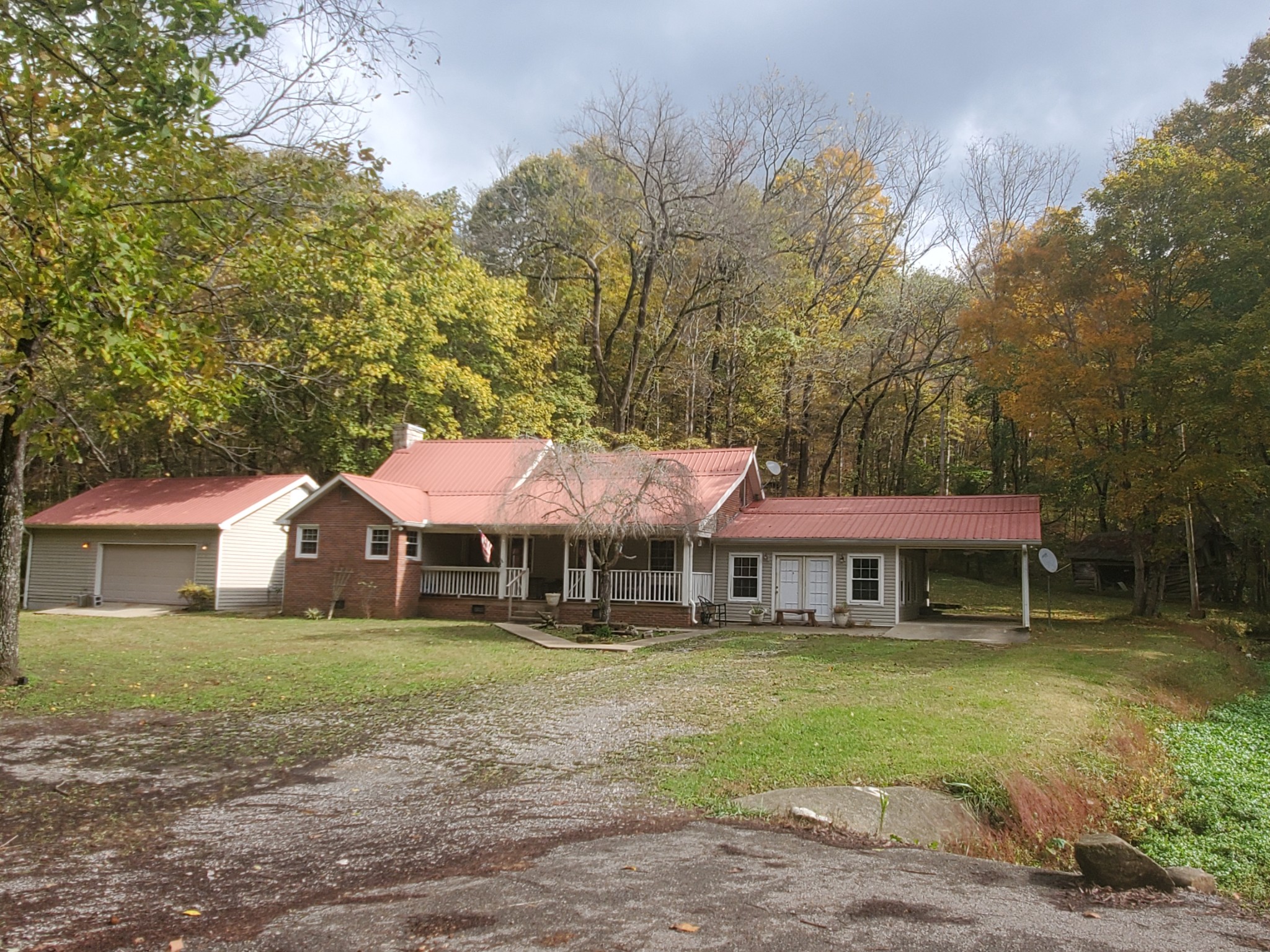 3979 Lem Davis Road Cunningham, TN 37052 - Photo 2 of 39 a front view of a house with garden
