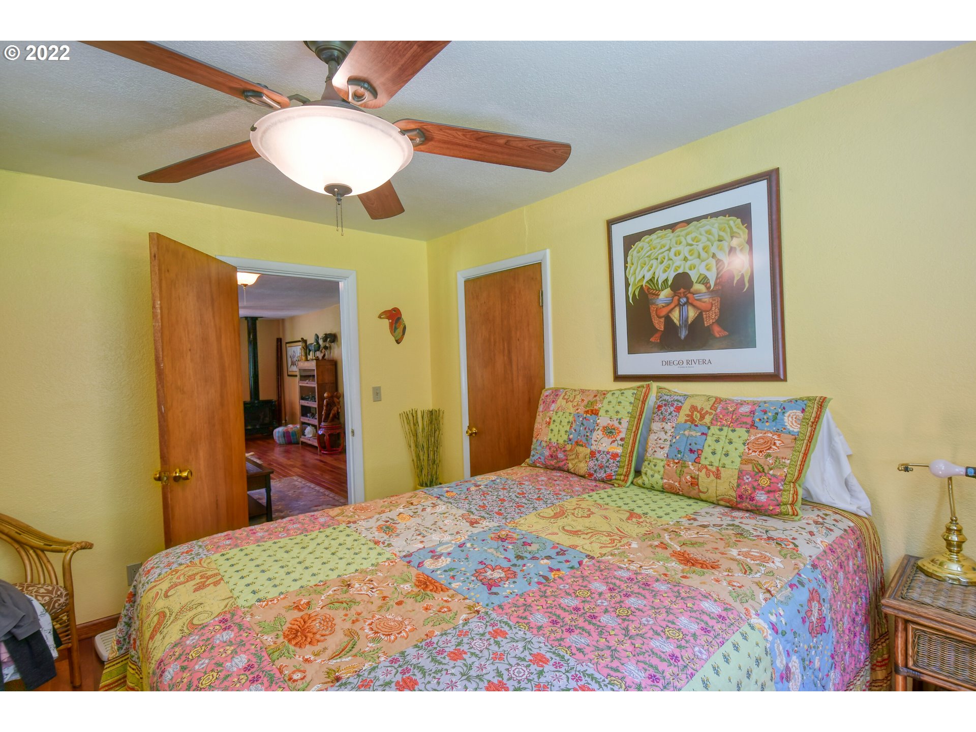 55568 Bingham Road Adams, OR 97810 - Photo 11 of 32 a bedroom with a bed and a chandelier