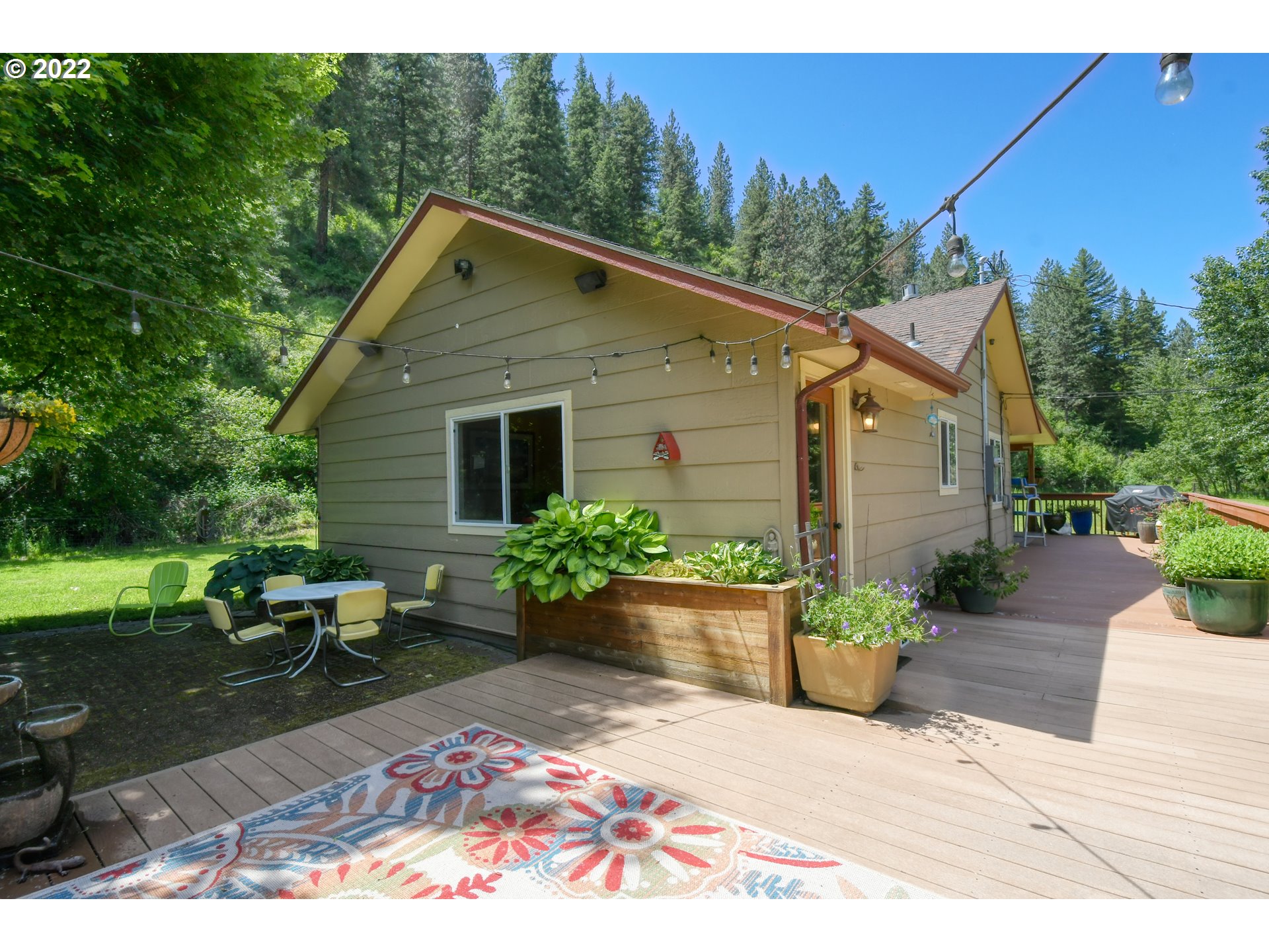 55568 Bingham Road Adams, OR 97810 - Photo 16 of 32 a view of a house with backyard sitting area and garden