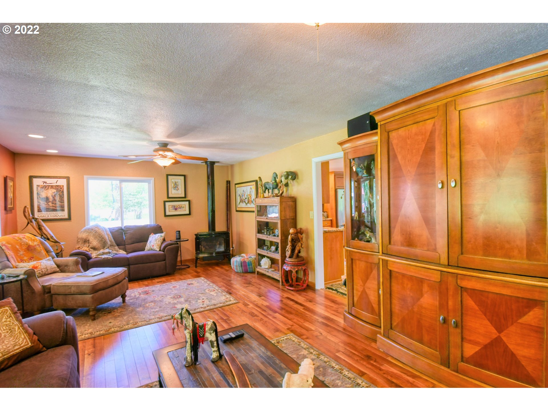 55568 Bingham Road Adams, OR 97810 - Photo 7 of 32 a living room with furniture a dining table and wooden floor