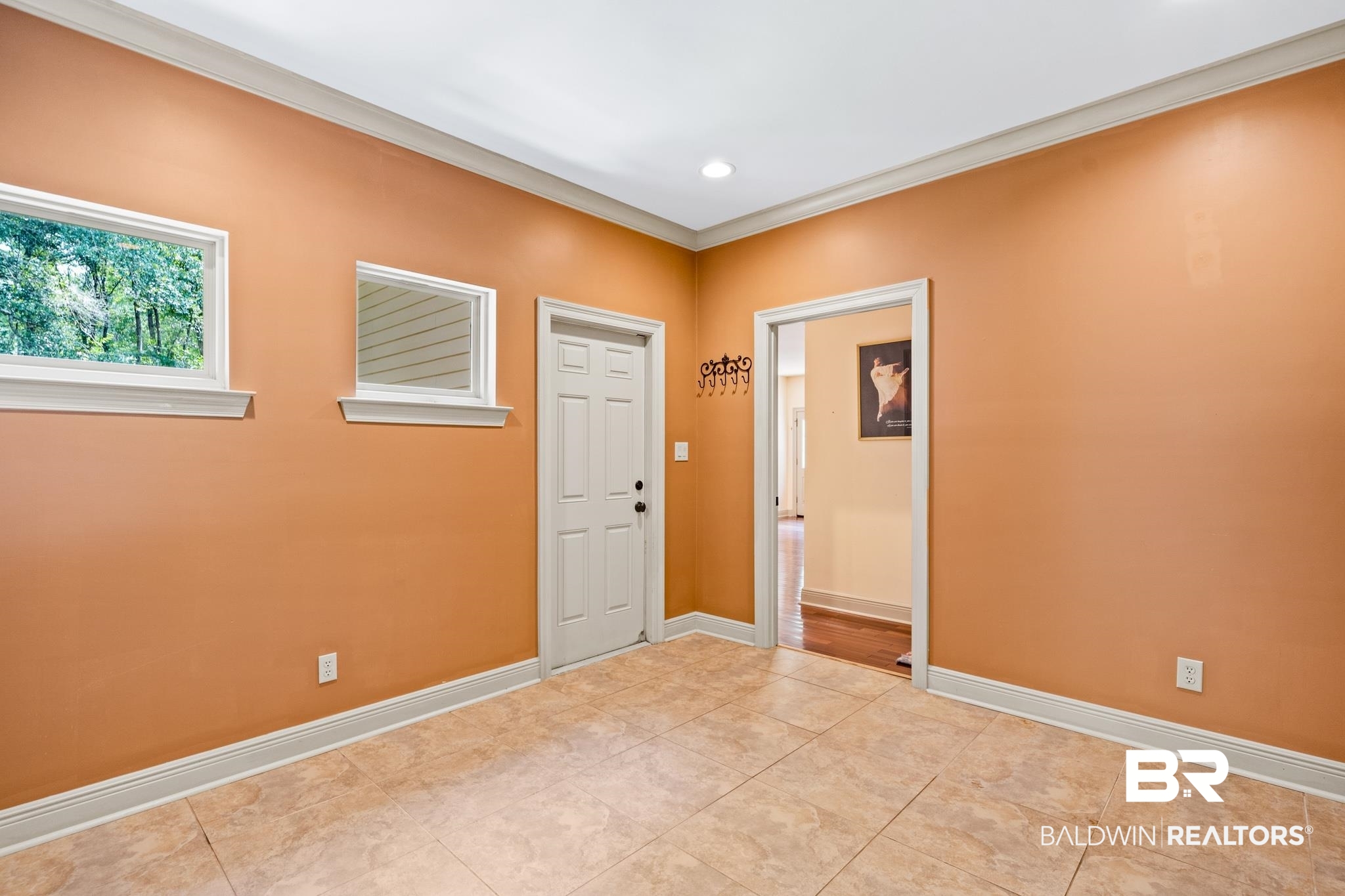 8321 Dixon Road Bay Minette, AL 36507 - Photo 39 of 79 Tiled empty room featuring crown molding