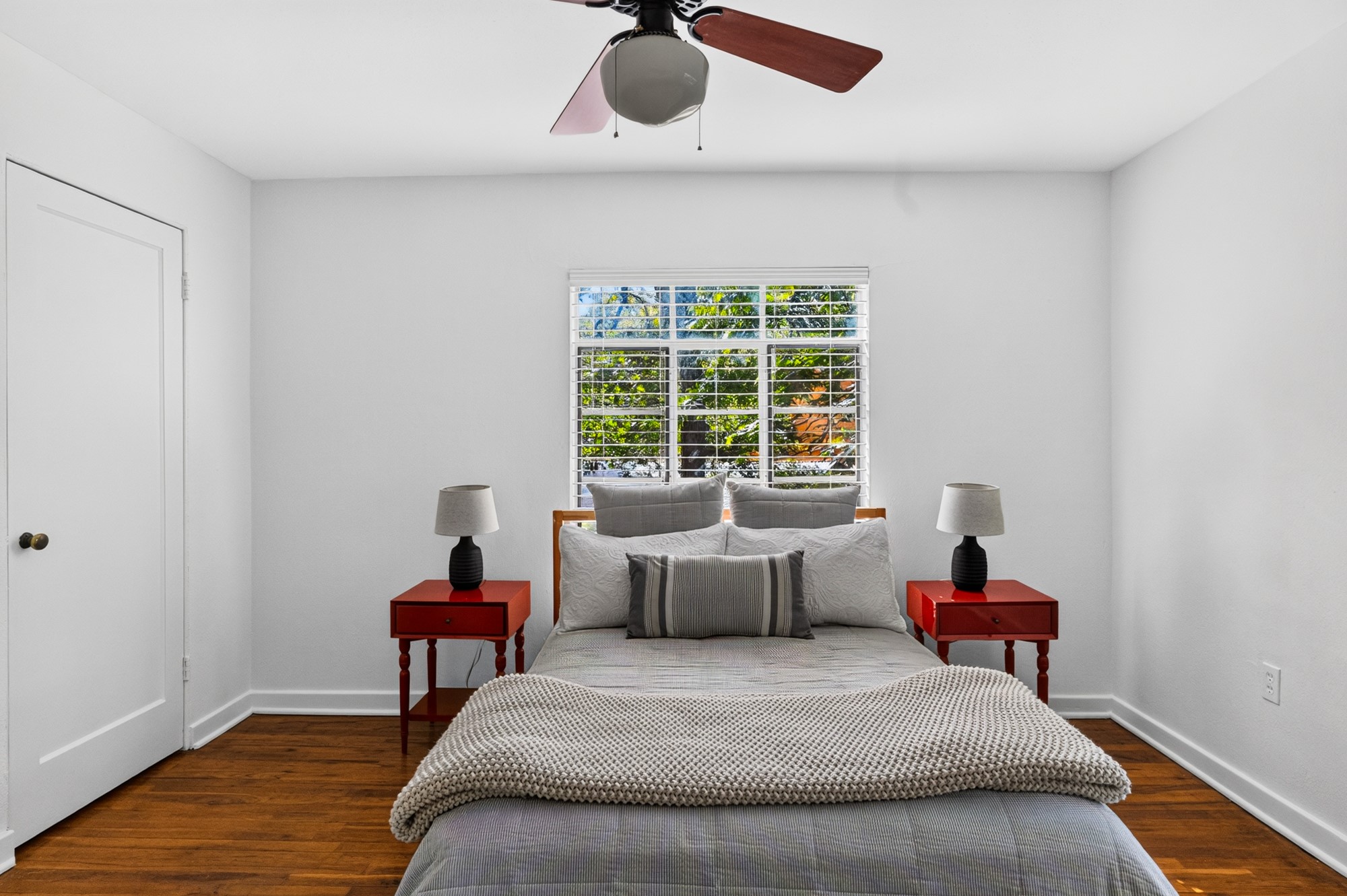 1302 Kirkwood Road, Unit B Austin, TX 78722 - Photo 13 of 21 Hardwood floors and bright window create a tranquil sleeping space.