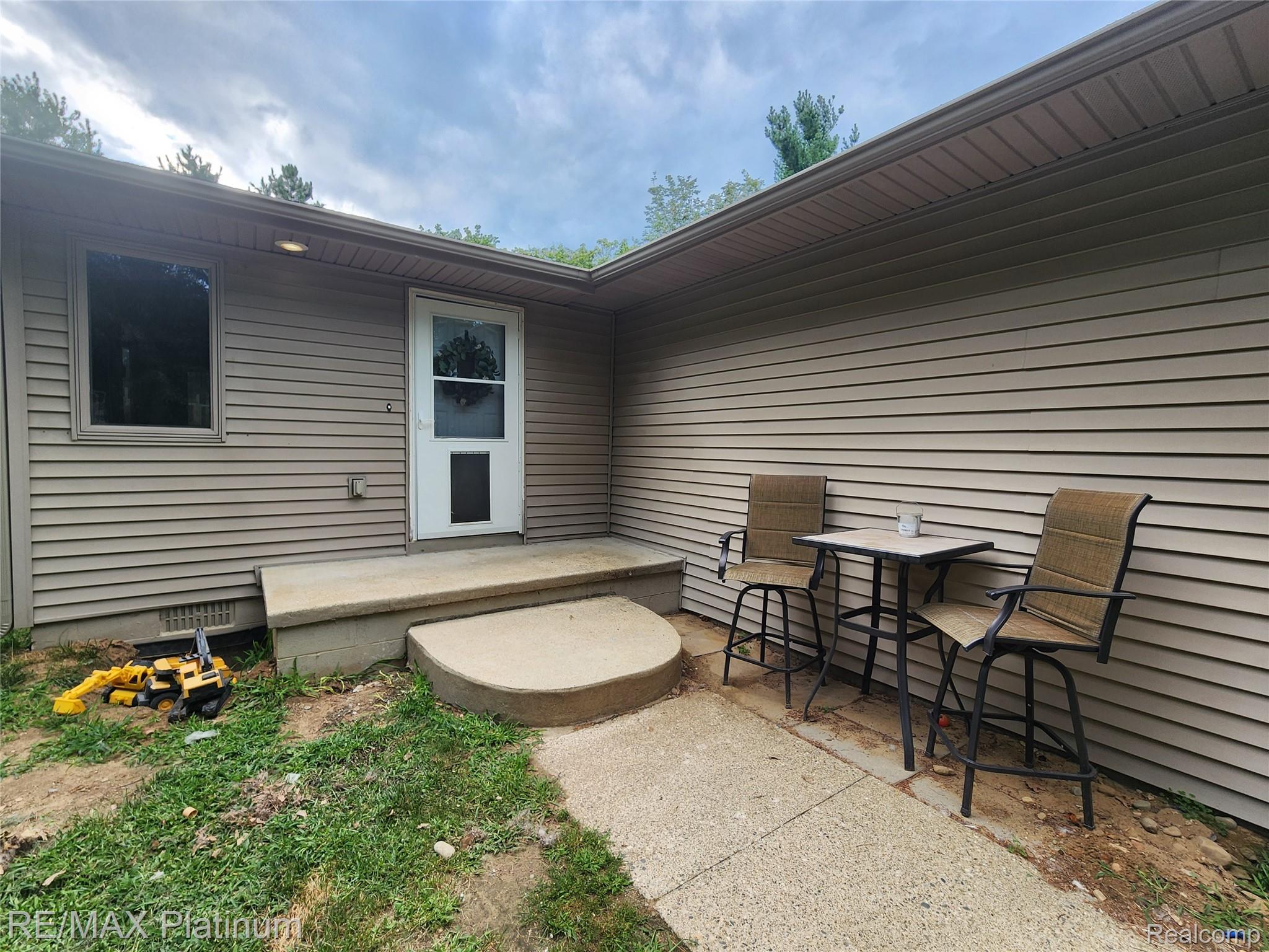 6451 Bullard Road Fenton, MI 48430 - Photo 5 of 26 Rear exit on backof home