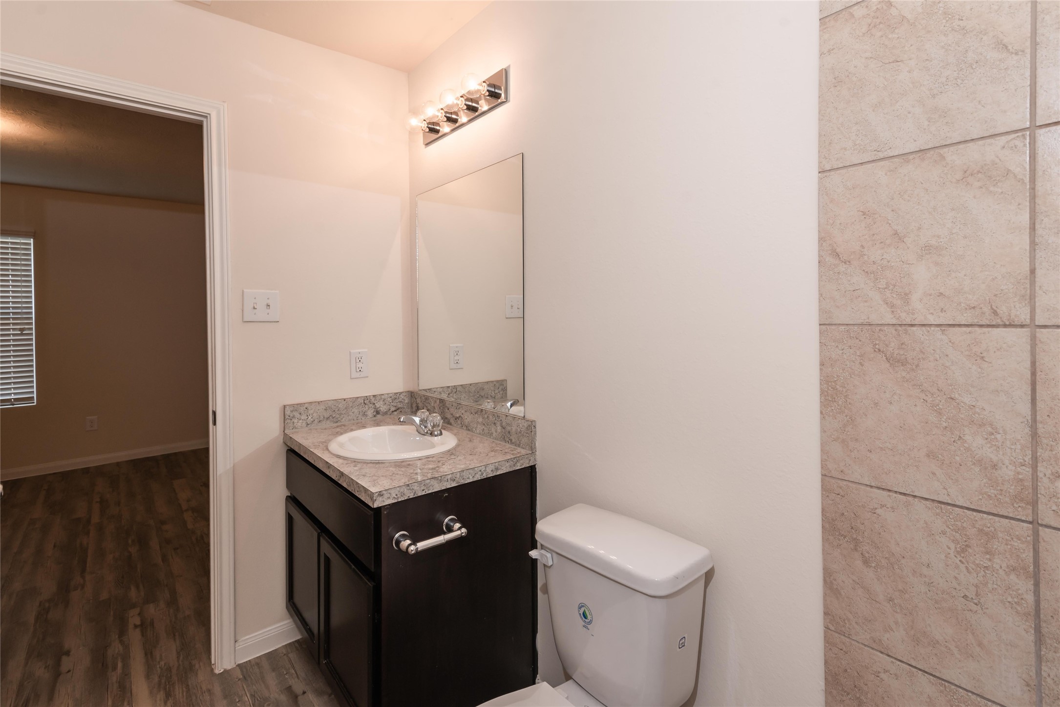 13030 Ristina Circle Houston, TX 77048 - Photo 8 of 10 a bathroom with a sink toilet and mirror