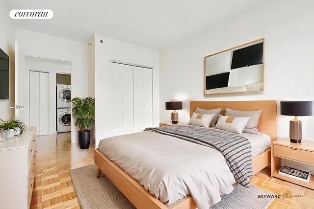 a bedroom with a bed and a flat screen tv