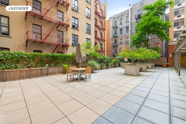 a view of a bedroom with a bed and a sink