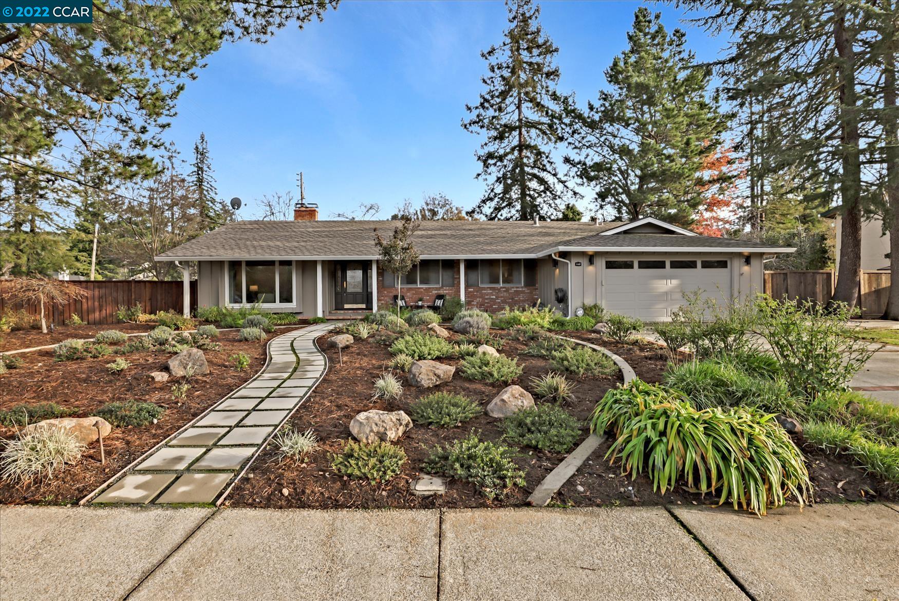 1127 Rimer Drive Moraga, CA 94556 - Photo 1 of 1 a front view of a house with garden