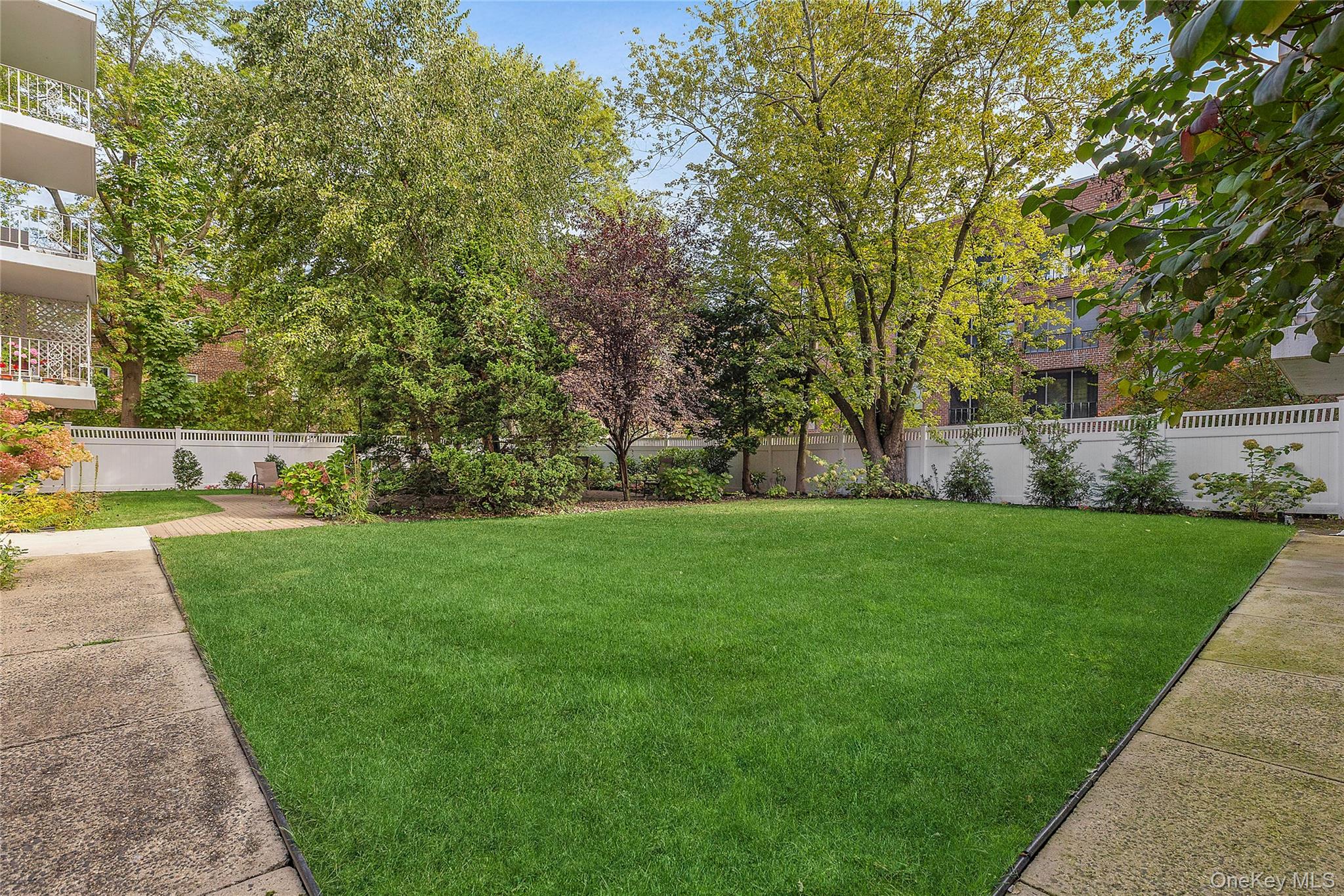 21 Chapel Place, Unit 3M Great Neck, NY 11021 - Photo 13 of 21 View of fenced backyard