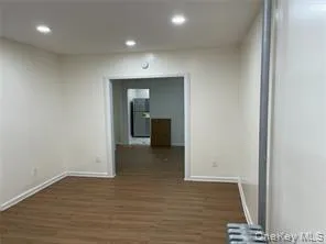 a view of a room with wooden floor and staircase