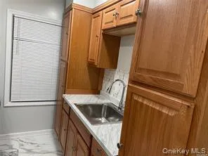 a bathroom with a sink a mirror and shower