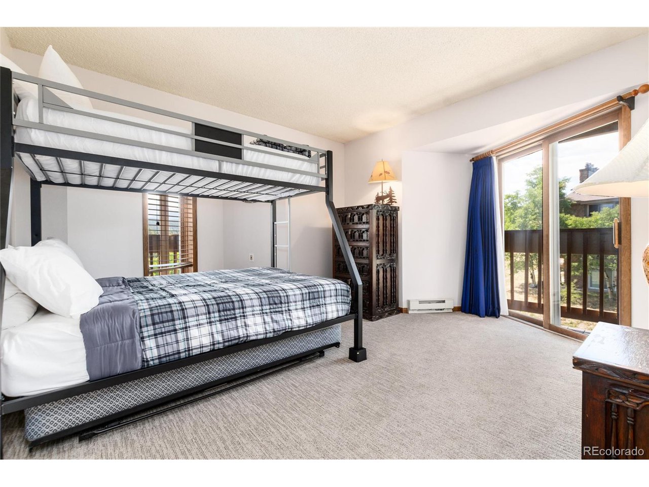 490 Kings Crossing Road, Unit 631 Winter Park, CO 80482 - Photo 24 of 43 a bedroom with a large bed and a large window