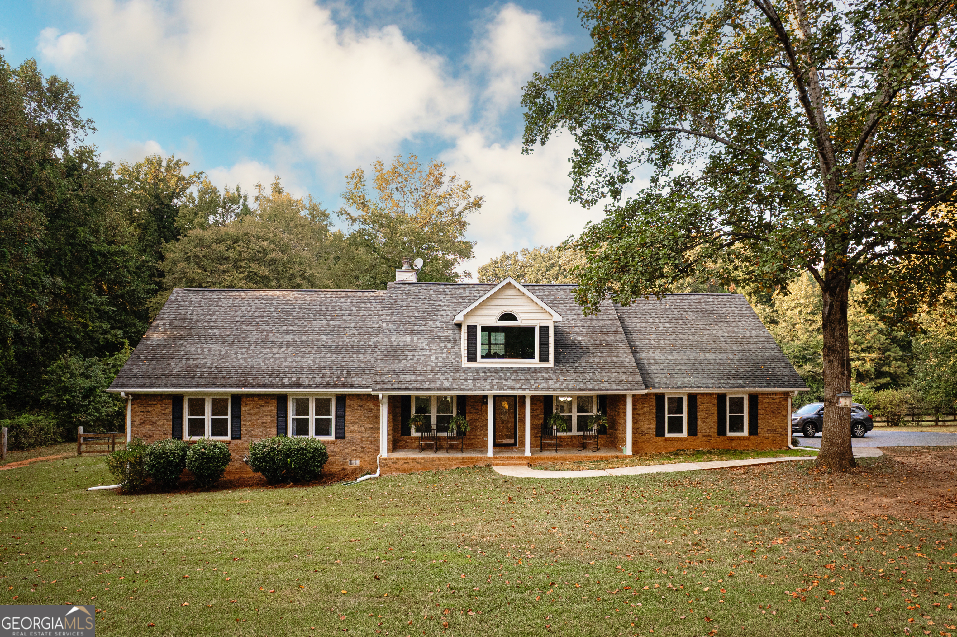 a front view of a house with garden