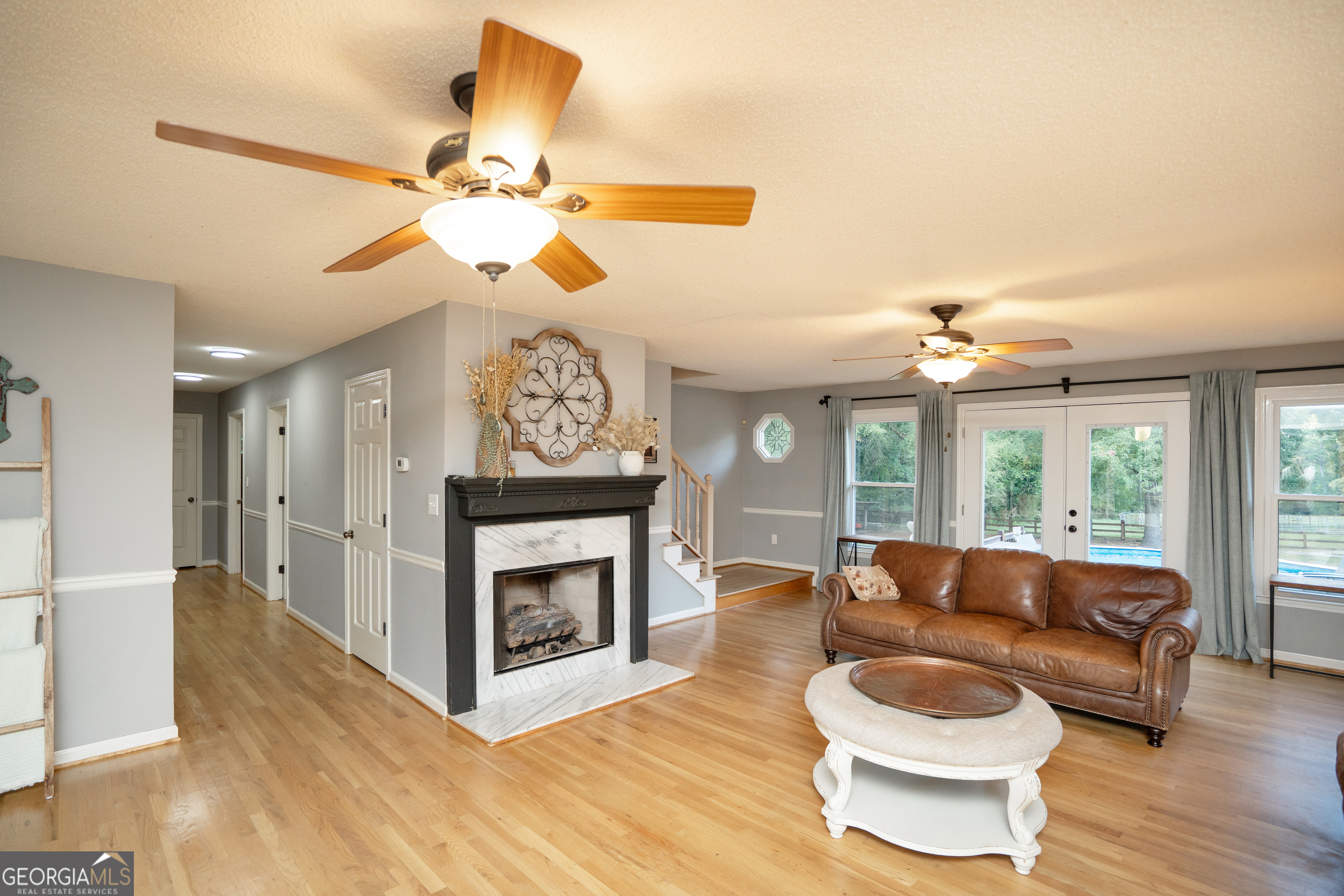 295 Hillview Road Hampton, GA 30228 - Photo 11 of 70 a living room with furniture a fireplace and a flat screen tv