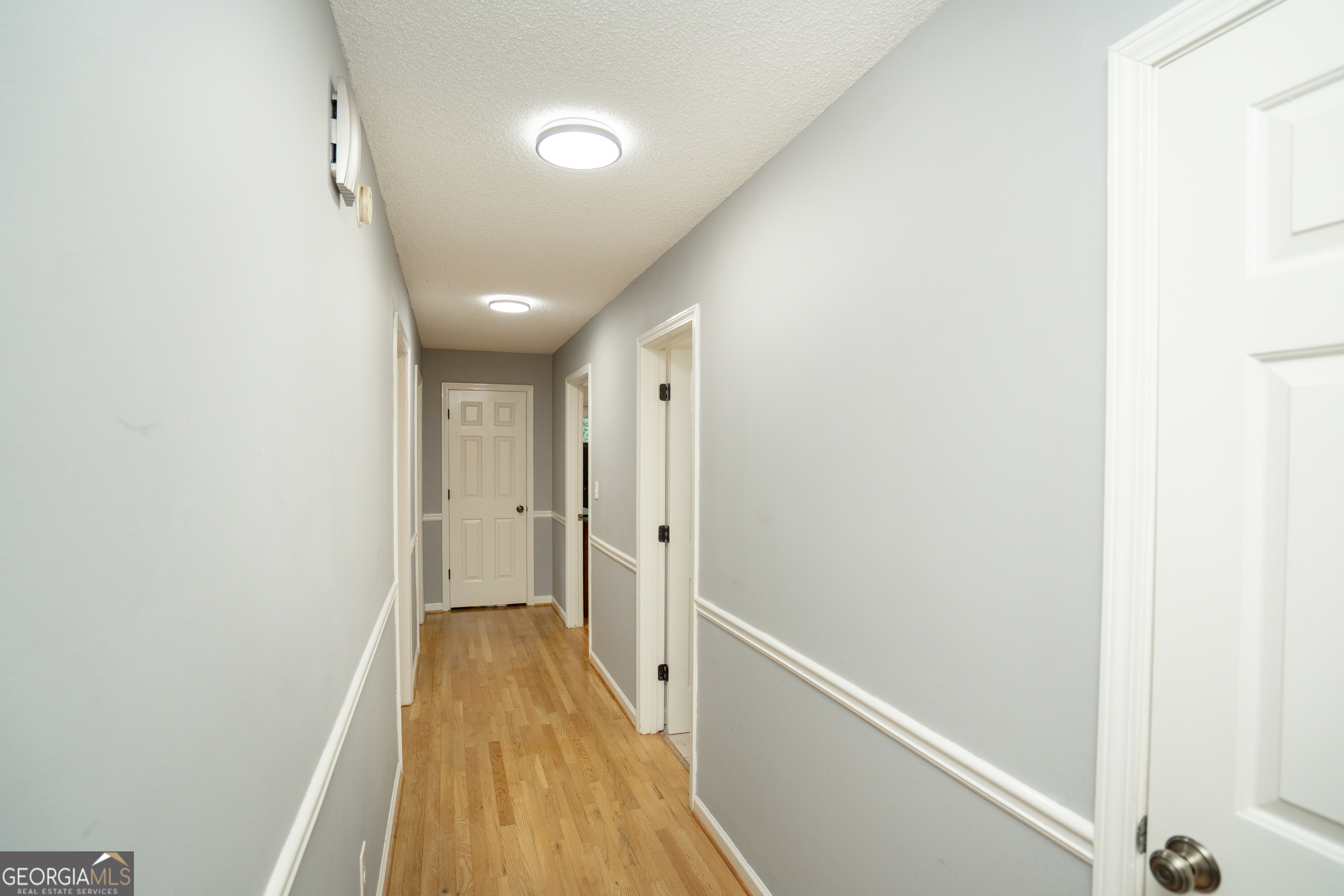 295 Hillview Road Hampton, GA 30228 - Photo 13 of 70 a view of a hallway with wooden floor and staircase
