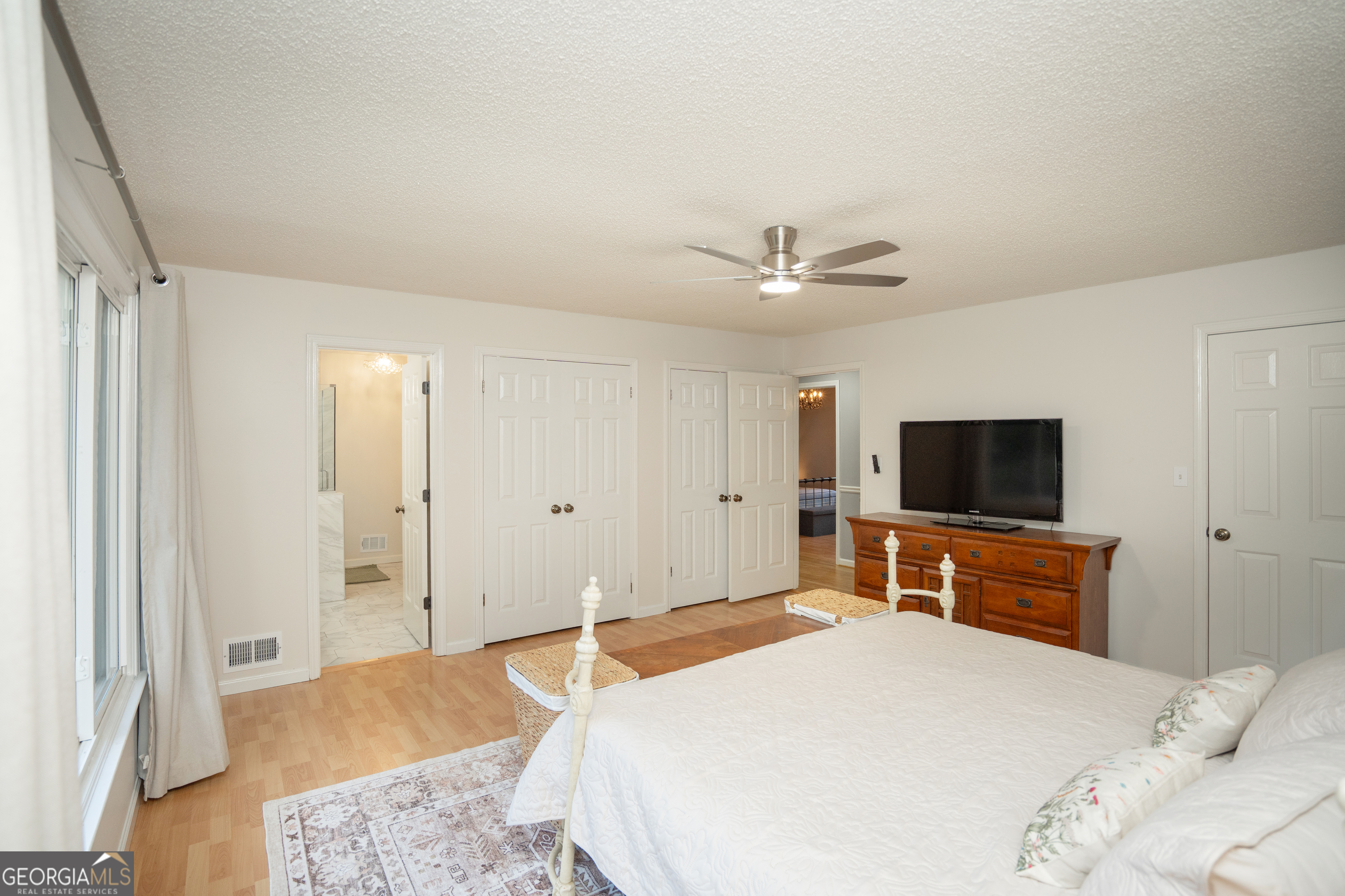 295 Hillview Road Hampton, GA 30228 - Photo 22 of 70 a bedroom with a bed and a flat screen tv