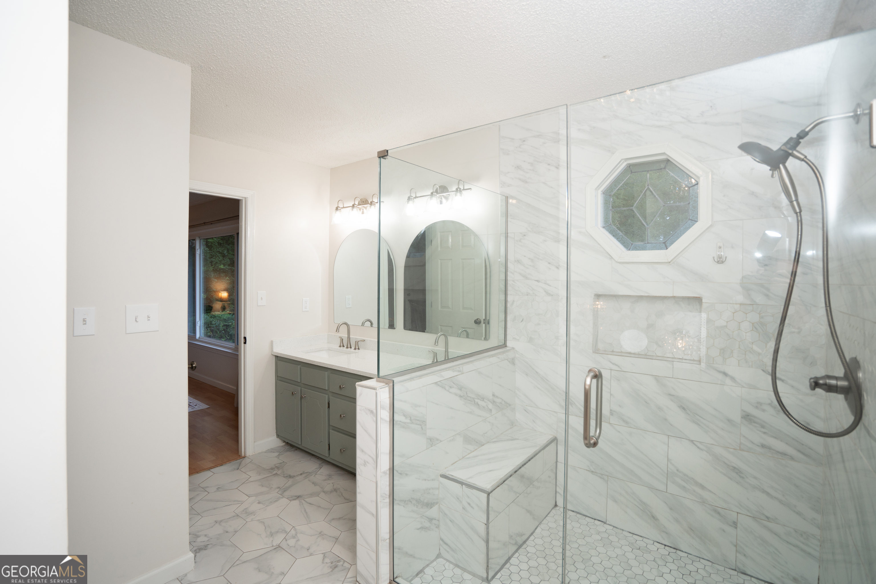 295 Hillview Road Hampton, GA 30228 - Photo 24 of 70 a bathroom with a glass shower door and mirror