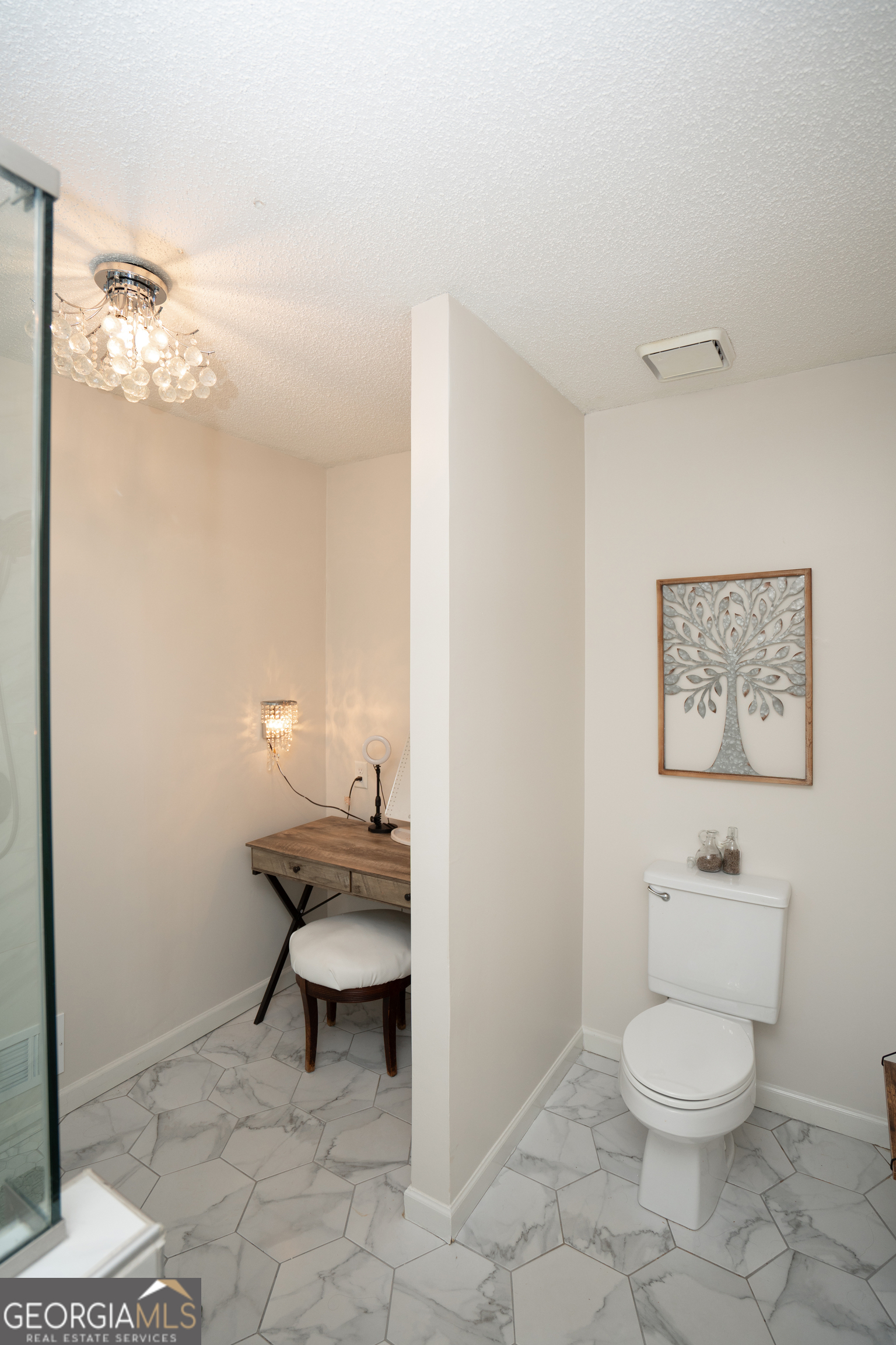 295 Hillview Road Hampton, GA 30228 - Photo 25 of 70 a bathroom with a toilet a sink and mirror