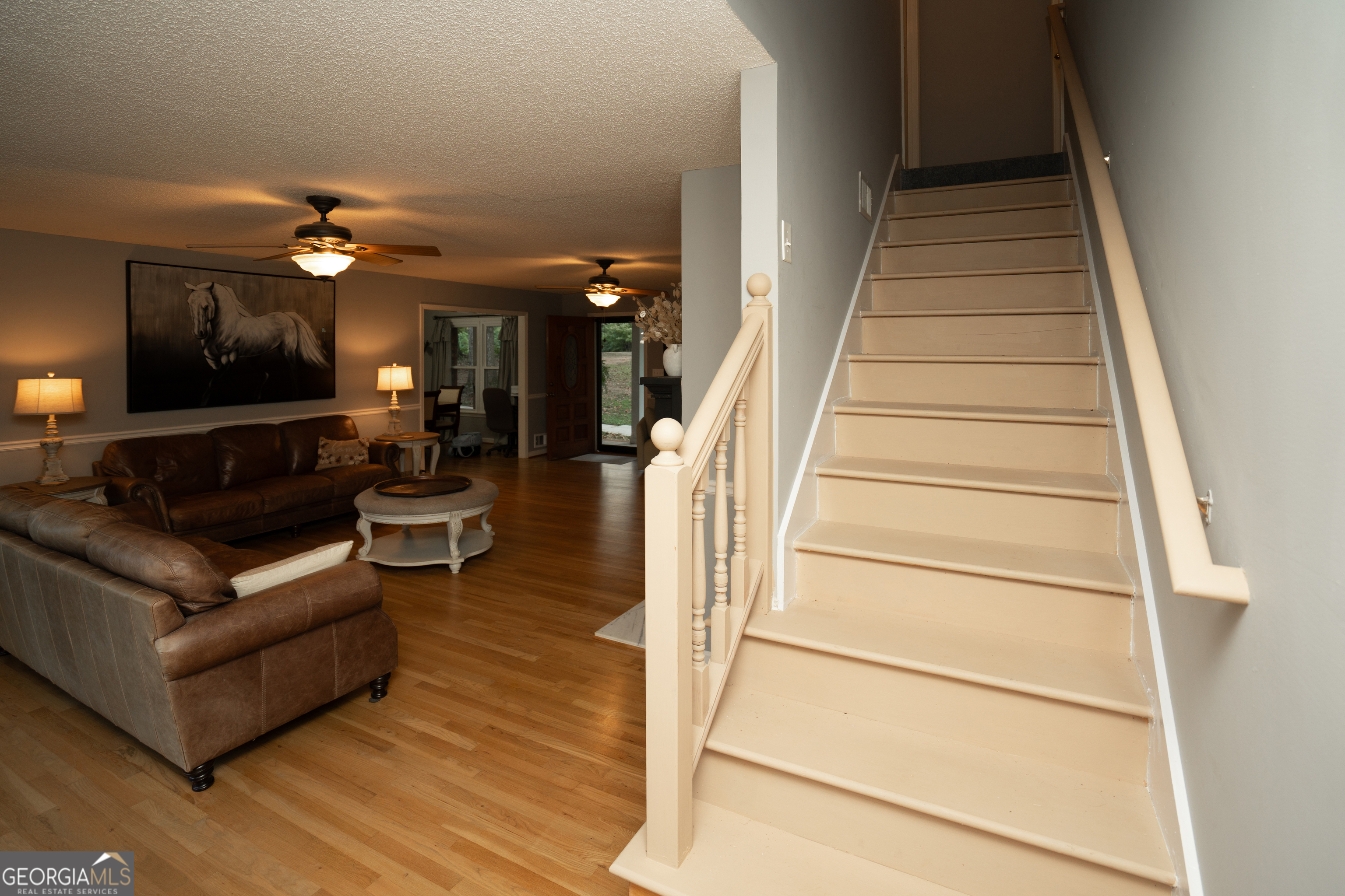 295 Hillview Road Hampton, GA 30228 - Photo 29 of 70 a living room with furniture and a chandelier