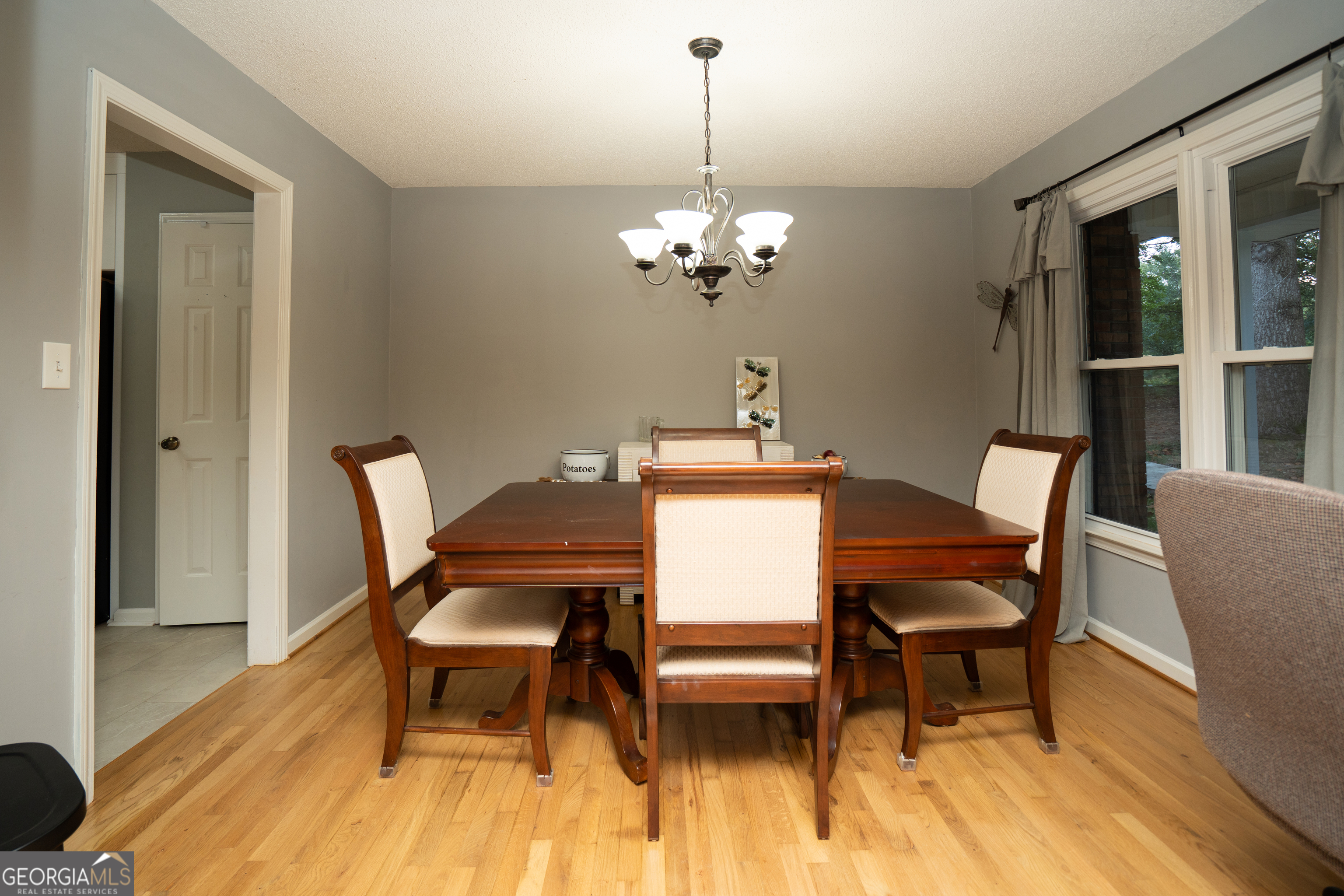 295 Hillview Road Hampton, GA 30228 - Photo 30 of 70 a view of a dining room with furniture and wooden floor