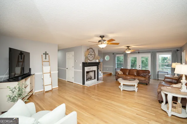 a living room with furniture and a flat screen tv