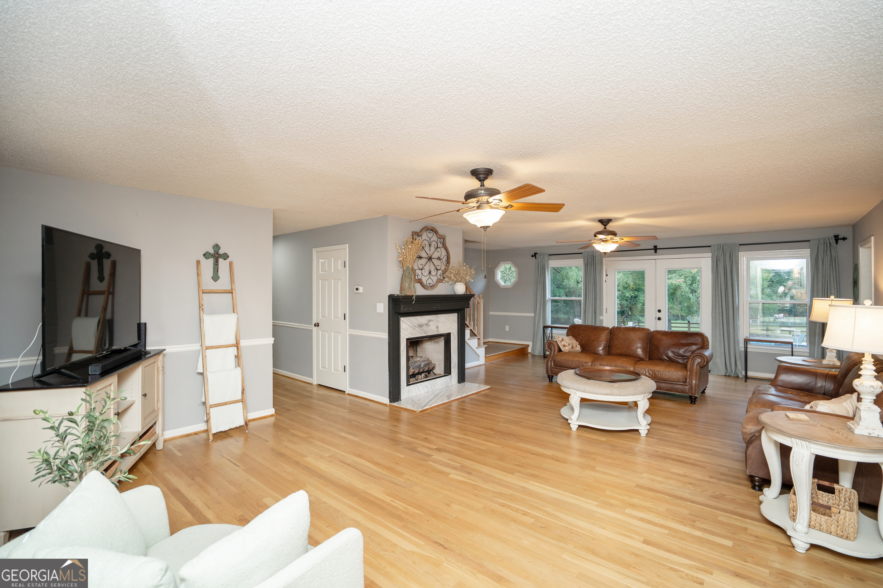295 Hillview Road Hampton, GA 30228 - Photo 3 of 70 a living room with furniture and a flat screen tv