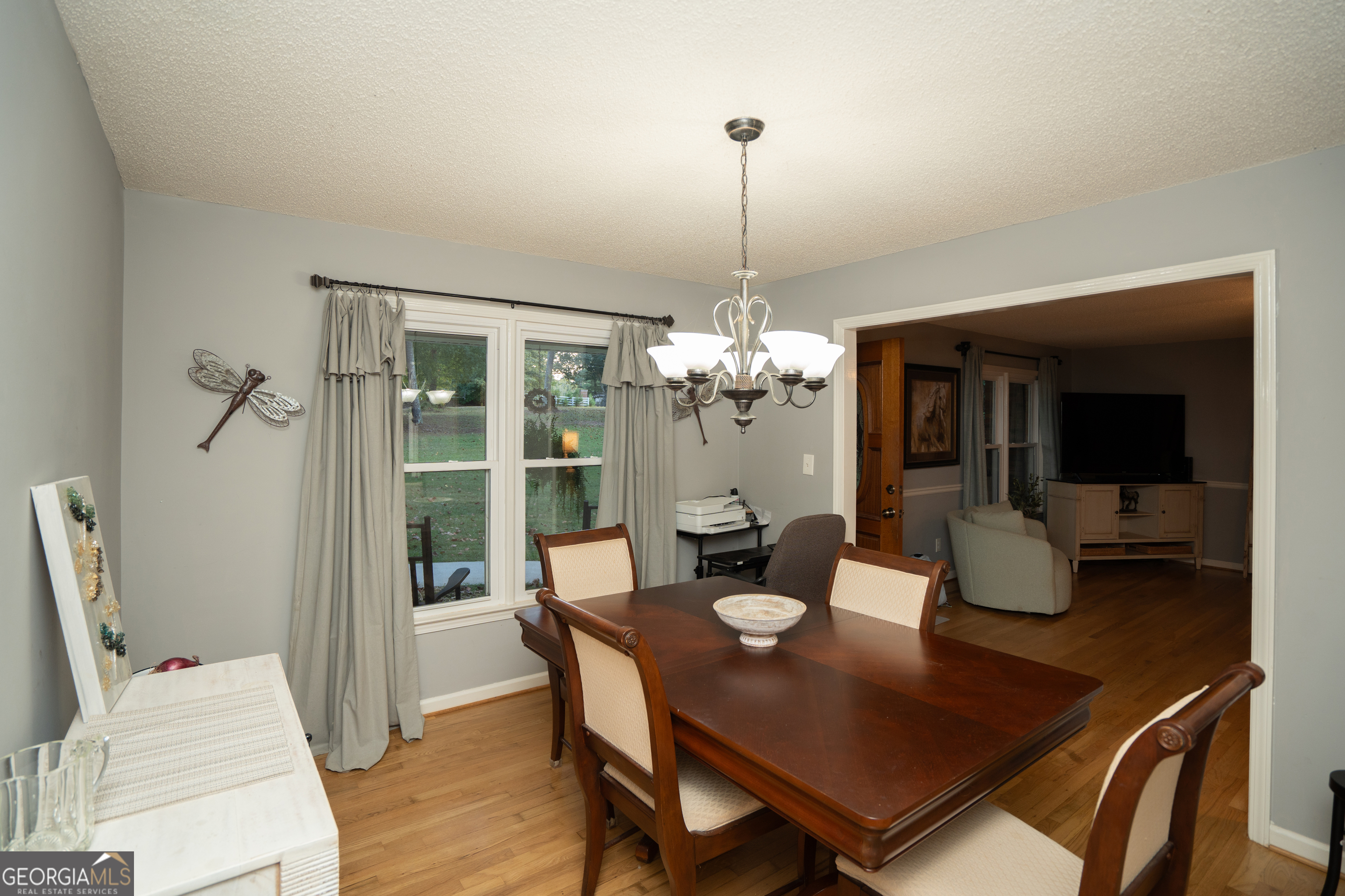 295 Hillview Road Hampton, GA 30228 - Photo 31 of 70 a view of a dining room with furniture wooden floor and chandelier