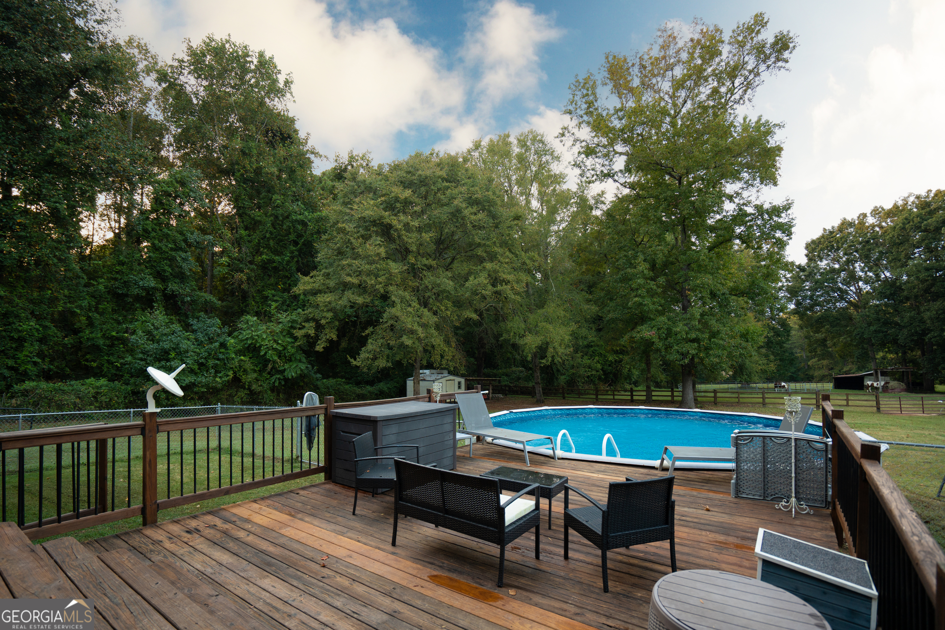 295 Hillview Road Hampton, GA 30228 - Photo 42 of 70 a view of a chairs and table on the deck