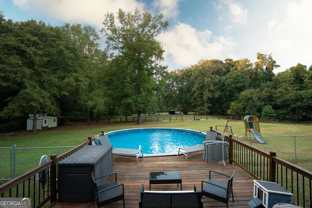 an aerial view of a house with pool