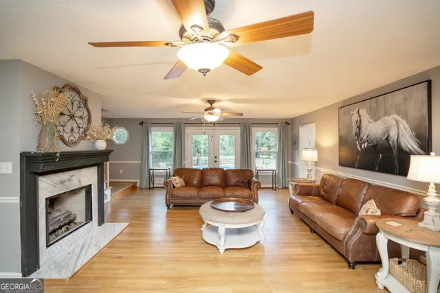 a living room with furniture and a fireplace