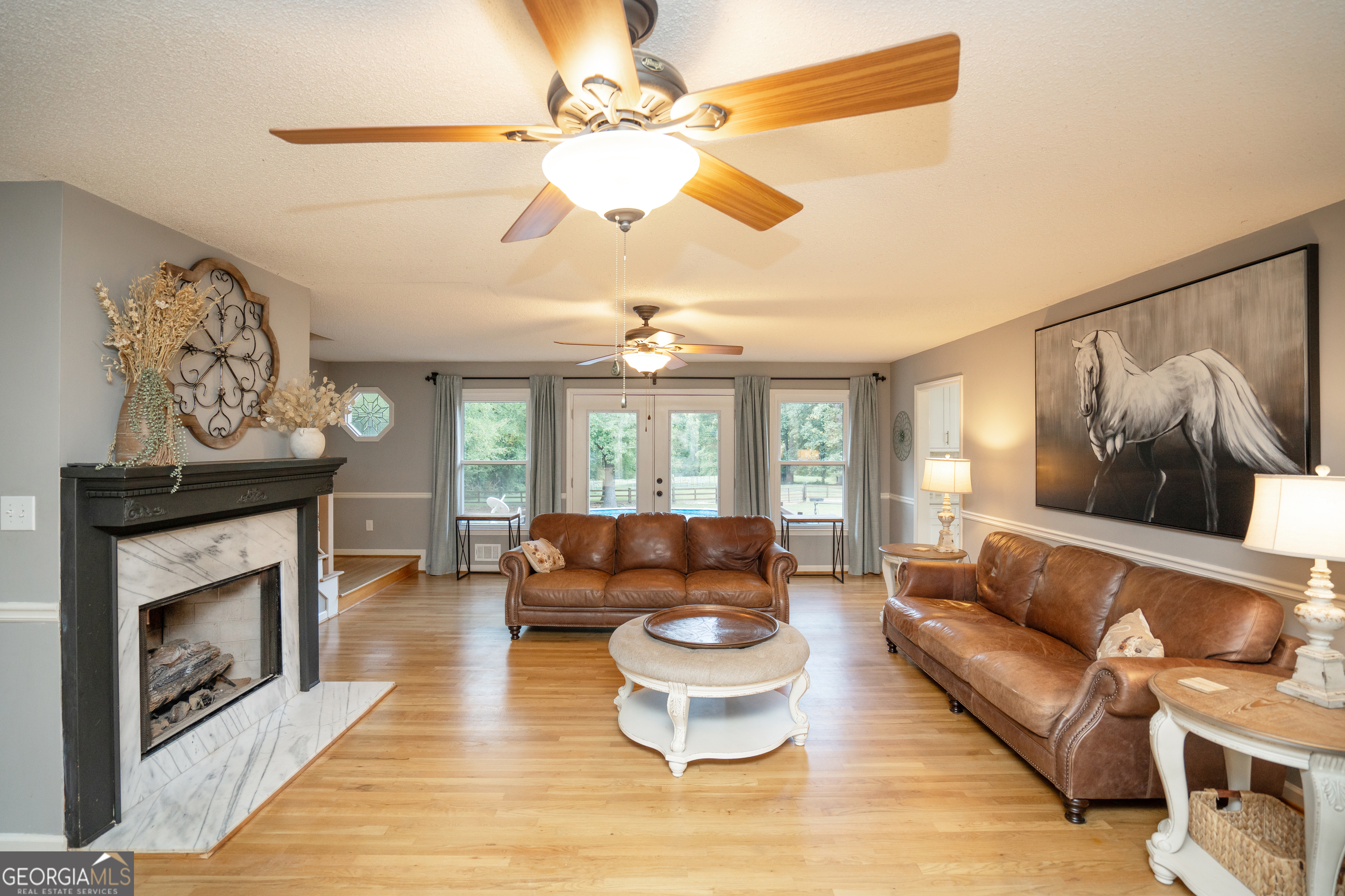 295 Hillview Road Hampton, GA 30228 - Photo 5 of 70 a living room with furniture and a fireplace